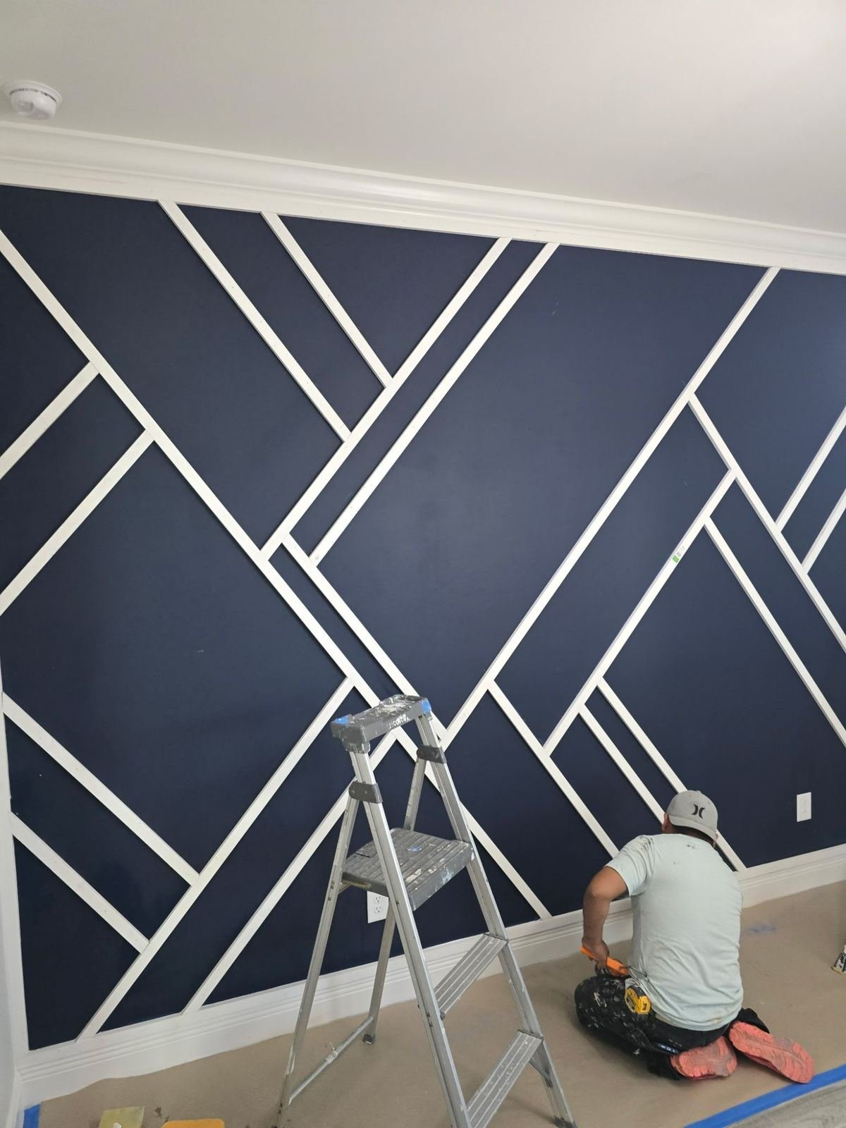 Geometric accent wall during installation with trim and paint Fort Myers FL