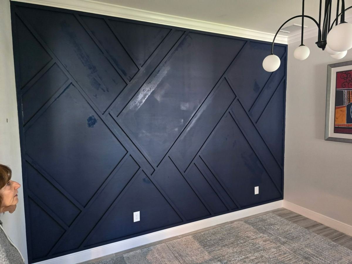 Completed geometric statement wall with navy blue paint and white trim Fort Myers FL