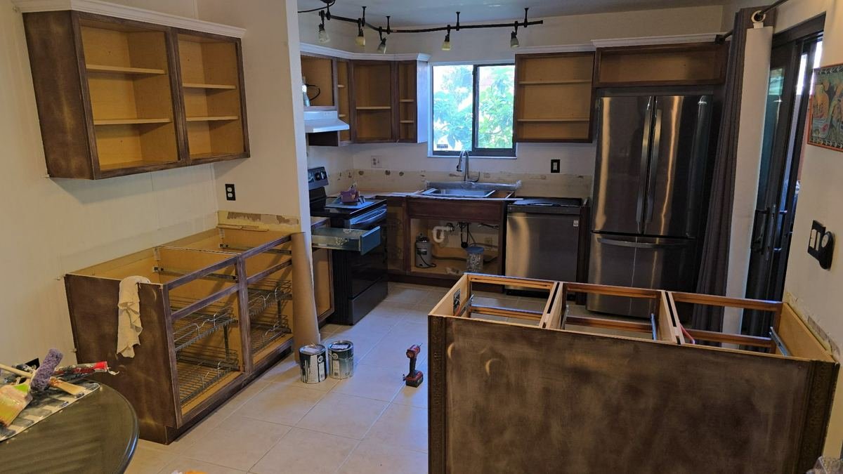 Kitchen before renovation with outdated cabinets in Cape Coral FL