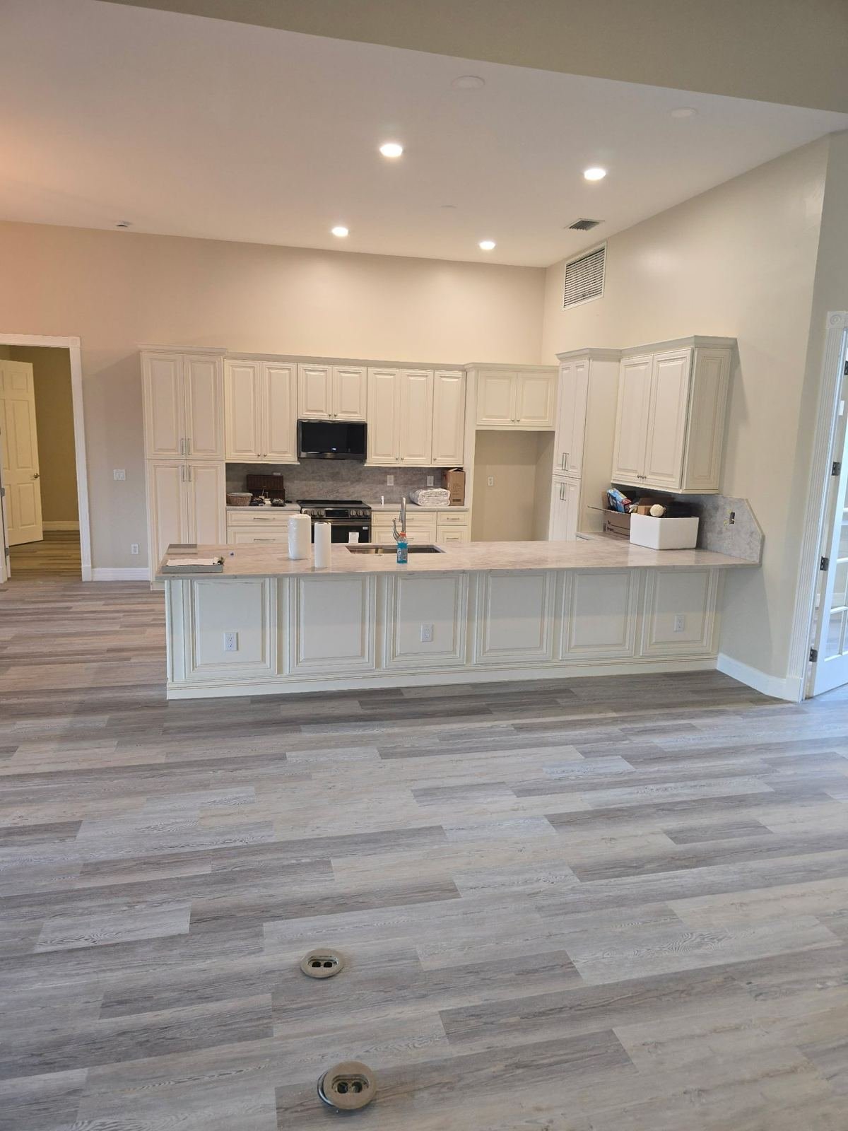 Completed kitchen renovation with white cabinetry and new countertops Fort Myers FL